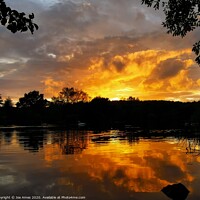 Buy canvas prints of Firey sunset at Osborne pond  by Joe Ames