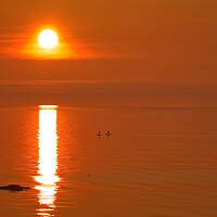Buy canvas prints of Paddleboarders enjoying the sunrise by Cecil Owens
