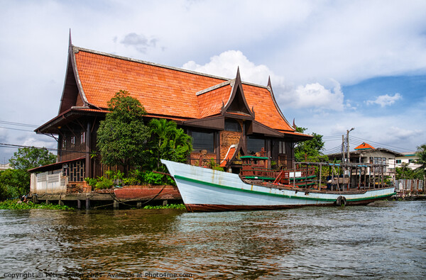 A large house on the banks of Chao Phraya, Bangkok, Thailand. Picture Board by Peter Bolton