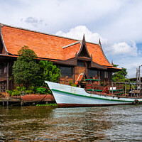 Buy canvas prints of A large house on the banks of Chao Phraya, Bangkok, Thailand. by Peter Bolton