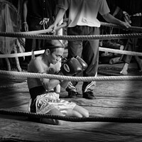Buy canvas prints of Muay Thai  boxer meditates before a bout. Bangkok, Thailand. by Peter Bolton