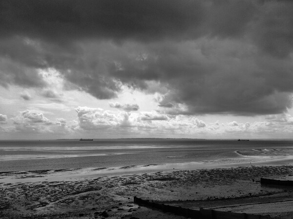 Black and white seascape across Thames Estuary from Thorpe Bay, Essex, UK. Picture Board by Peter Bolton