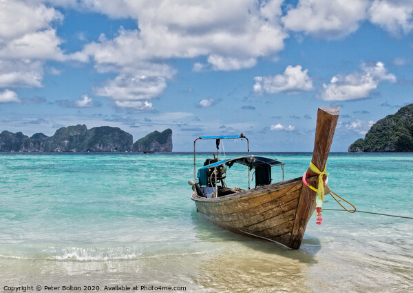 Long tail boat on the beach at Ko Phi Phi Leh, Krabi Province, Thailand. Picture Board by Peter Bolton