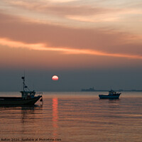 Buy canvas prints of Setting sun above the pier at Southend on Sea, Essex, UK. by Peter Bolton