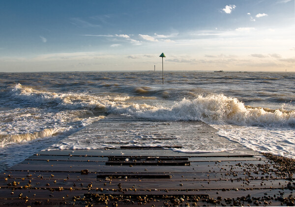 Outgoing tide at Sailing club jetty, Thorpe Bay, Essex, UK. Picture Board by Peter Bolton