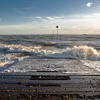 Buy canvas prints of Outgoing tide at Sailing club jetty, Thorpe Bay, Essex, UK. by Peter Bolton