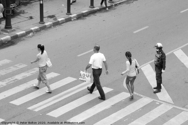 People on a pedestrian crossing in Bangkok. Picture Board by Peter Bolton