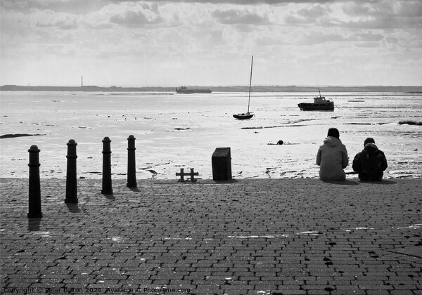 Sitting on the edge of the dock taking in the view. Old Leigh, Essex, UK. Picture Board by Peter Bolton