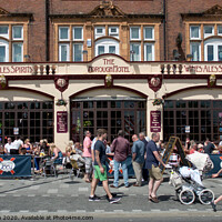 Buy canvas prints of Summer visitors outside the old Borough Hotel public house on the seafront at Southend on Sea, Essex. by Peter Bolton