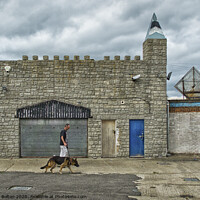 Buy canvas prints of Man and dog walk in front of abandoned seaside arcade at Southend on Sea, Essex. by Peter Bolton