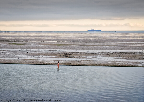 A lone bather in a formal seawater pool at East Beach, Shoeburyness, Essex, on the River Thames. Picture Board by Peter Bolton
