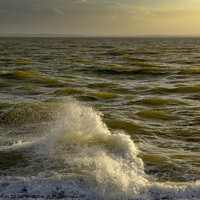 Buy canvas prints of A single breaking wave caught in the fading light of a sunset At The Garrison, Shoeburyness, Essex, UK. by Peter Bolton