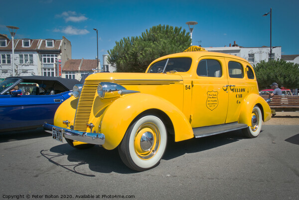 'Big Yellow Taxi' on display at Southend on Sea, Essex, UK. Vintage vehicle at a show. Picture Board by Peter Bolton
