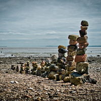 Buy canvas prints of 'Land art' on East Beach, Shoeburyness, Essex, UK. made from found stones, and rocks. Remains of historic victorian military buildings on the shoreline. by Peter Bolton