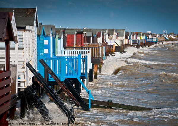 High tide at Thorpe Bay with beach huts. Picture Board by Peter Bolton