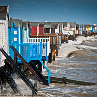 Buy canvas prints of High tide at Thorpe Bay with beach huts. by Peter Bolton