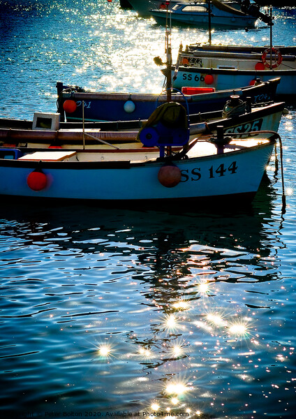 Small boats at anchor in St. Ives harbour with sun light and shadows. Cornwall. Picture Board by Peter Bolton