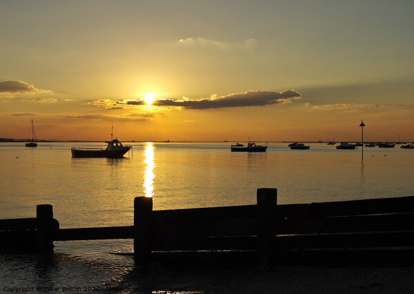 Sunset over the sea at Thorpe Bay, Essex, UK Picture Board by Peter Bolton