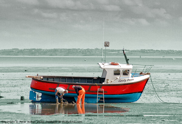 Fishermen maintain their boat at Thorpe Bay, Thames Estuary, Essex. Picture Board by Peter Bolton