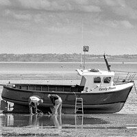 Buy canvas prints of Fishermen maintain their boat at low tide at Thorpe Bay, Essex, UK. by Peter Bolton