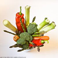 Buy canvas prints of A variety of fresh vegetables arranged in a pot as a still life graphic design by Peter Bolton