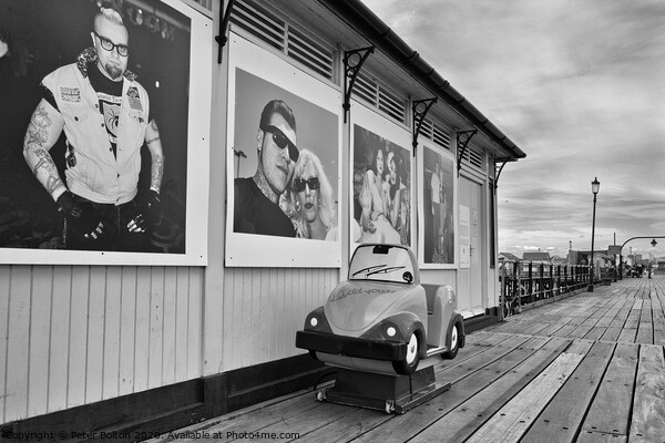 A shelter and children's coin operated ride on Southend pier, Essex, UK. Picture Board by Peter Bolton