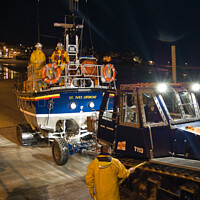 Buy canvas prints of 'Back from a shout'. St. Ives lifeboat returning at night. Cornwall, UK by Peter Bolton