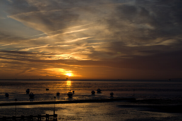 An amazing sunset over the estuary at Westcliff on Sea, Essex, UK Picture Board by Peter Bolton