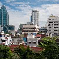 Buy canvas prints of Cityscape of Bangkok, Thailand, showing dwellings and high rise buildings. by Peter Bolton