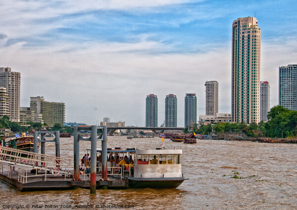 Ferry terminal with cityscape on the Chao Phraya River, Bangkok, Thailand. Picture Board by Peter Bolton