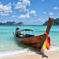 Buy canvas prints of Long-tail boat pulled up on the beach, Phi Phi Island, Thailand. by Peter Bolton