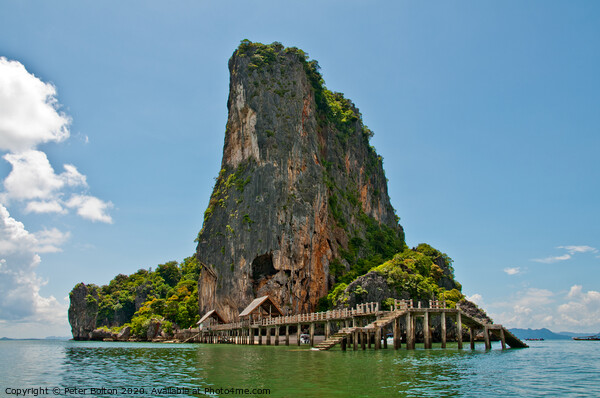 Limestone outcrop with landing stage. Phi Phi Island group, Thailand . Picture Board by Peter Bolton