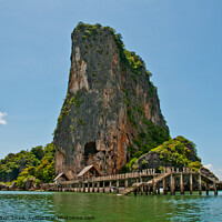 Buy canvas prints of Limestone outcrop with landing stage. Phi Phi Island group, Thailand . by Peter Bolton