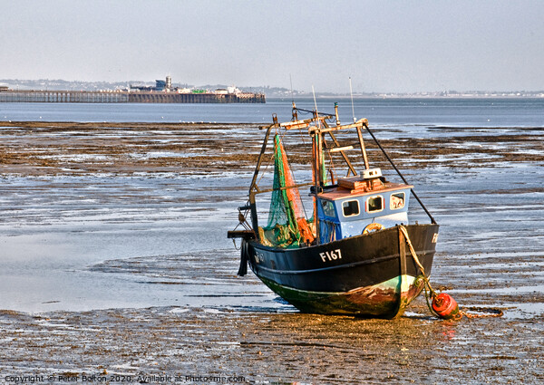 Fishing boat and Southend on Sea Pier, Essex, UK. Picture Board by Peter Bolton