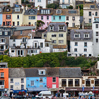 Buy canvas prints of Detail of some of the colourful houses surrounding the harbour in Brixham, Devon, UK. by Peter Bolton