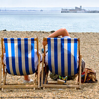 Buy canvas prints of A couple on the beach in deckchairs silhouetted through the canvas at Southend on Sea, Essex, UK. by Peter Bolton