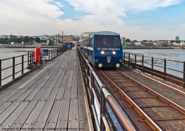 A train makes it way along the pier at Southend on Sea, Essex, UK Picture Board by Peter Bolton