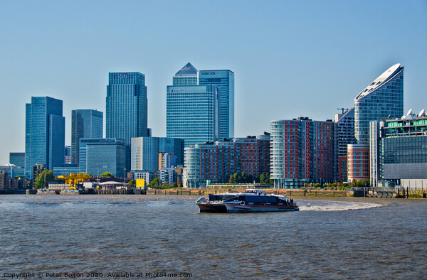 Canary Wharf Business District from the River Thames, London, UK. Picture Board by Peter Bolton
