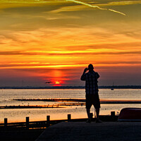 Buy canvas prints of Watching the sunset at Chalkwell, Southend on Sea, Essex, UK. by Peter Bolton