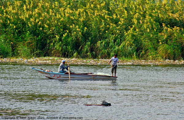 Fishermen in a boat on The River Nile near Cairo, Egypt. Picture Board by Peter Bolton