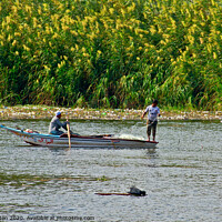 Buy canvas prints of Fishermen in a boat on The River Nile near Cairo, Egypt. by Peter Bolton