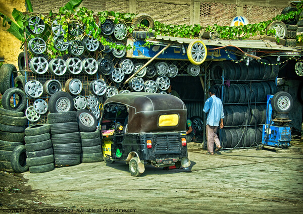 Tyre fitter business on the outskirts of Cairo, Egypt. Picture Board by Peter Bolton