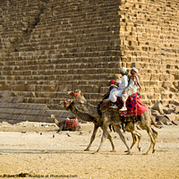 Buy canvas prints of Pyramid of Menkaure with passing camels, Giza, Egypt. by Peter Bolton
