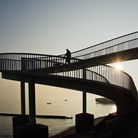 Buy canvas prints of An 'abstract style' footbridge in silhouette at Leigh on Sea, Essex, UK. by Peter Bolton