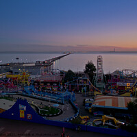 Buy canvas prints of Evening view of the seafront at Southend on Sea showing 'Adventure Island' and the pier. by Peter Bolton