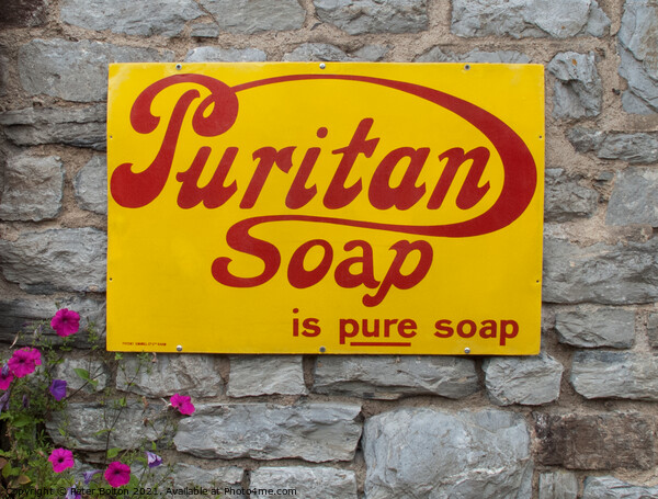 Enamel sign advertising Puritan soap on a wall in Buckfastleigh, Devon. Picture Board by Peter Bolton