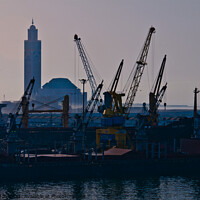 Buy canvas prints of Docks at Casablanca harbour with the Grand Mosque in the background. by Peter Bolton