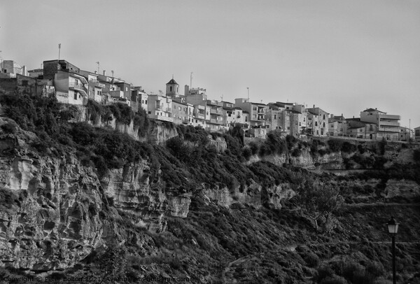 One of the Pueblos Blancos (white villages) near Malaga, Spain. Black and white. Picture Board by Peter Bolton