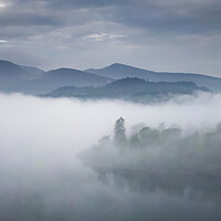 Buy canvas prints of Leaden Grey Skies Over Derwentwater by Chester Tugwell