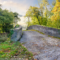 Buy canvas prints of Serene Autumn Stone Bridge Neath canal by Peter Thomas